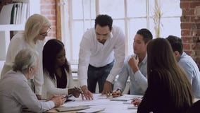 Business team people brainstorm solve mistakes in paperwork at meeting