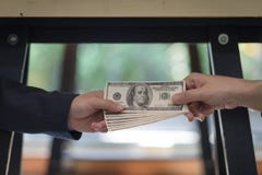 Corrupted two businessman sealing the deal with a handshake and receiving a bribe money. royalty free stock image Corrupted two businessman sealing the deal with a handshake and receiving a bribe money. royalty free stock image