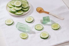 Cosmetic bottle and fresh organic cucumber for skincare. Home sp stock photography Cosmetic bottle and fresh organic cucumber for skincare. Home sp stock photography