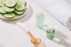 Cosmetic bottle and fresh organic cucumber for skincare. Home sp royalty free stock photos Cosmetic bottle and fresh organic cucumber for skincare. Home sp royalty free stock photos