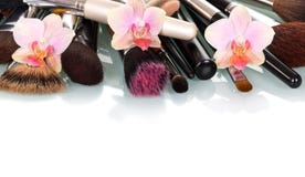 Cosmetic Makeup Brush And Orchid Flowers Isolated On White. Stock Photography