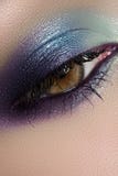 Cosmetics, macro eye make-up. Fashion sea shadows royalty free stock photography Cosmetics, macro eye make-up. Fashion sea shadows royalty free stock photography