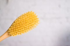 Cosmetology, grooming, Spa cosmetic products, beauty and bikini concept. close up wooden soft massage brush for body and legs on w royalty free stock photos Cosmetology, grooming, Spa cosmetic products, beauty and bikini concept. close up wooden soft massage brush for body and legs on w royalty free stock photos