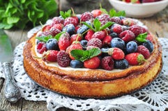 Cottage cheese casserole with fresh strawberries, blueberries, raspberries and mint and powdered sugar. Dinner Stock Photos Cottage cheese casserole with fresh strawberries, blueberries, raspberries and mint and powdered sugar. Dinner Stock Photos
