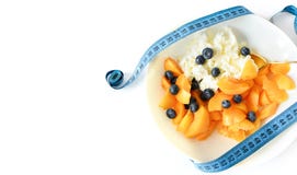 Cottage cheese and fruit and measuring tape. selective focus. Diet concept. Healthy and fiber breakfast, slimming food. stock photos Cottage cheese and fruit and measuring tape. selective focus. Diet concept. Healthy and fiber breakfast, slimming food. stock photos