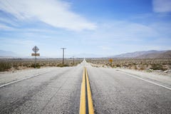 Country Road Through Desert Looking Towards Horizon royalty free stock images Country Road Through Desert Looking Towards Horizon royalty free stock images