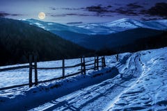 Country Road In To The Winter Mountains At Night Stock Photos Country Road In To The Winter Mountains At Night Stock Photos