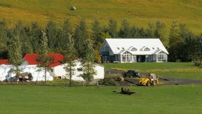 Countryside landscape of big farmers house and warehouses with harvested crop, car, tractor stock video footage Countryside landscape of big farmers house and warehouses with harvested crop, car, tractor stock video footage
