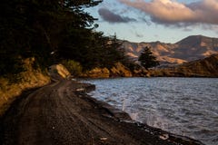 Countryside road near lake and mountains royalty free stock photos Countryside road near lake and mountains royalty free stock photos