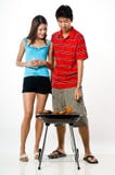 Couple And BBQ Royalty Free Stock Photo Couple And BBQ Royalty Free Stock Photo