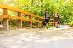 Couple backpacker hiking in forest pathway stock photo Couple backpacker hiking in forest pathway stock photo