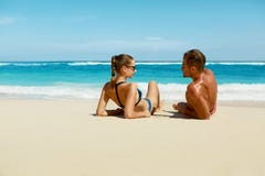 Couple On Beach In Summer. Romantic People On Sand At Resort stock image Couple On Beach In Summer. Romantic People On Sand At Resort stock image