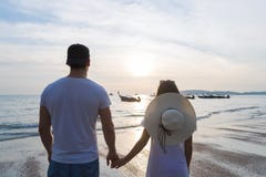Couple Beach Summer Vacation, Man Woman Holding Hands Sunset Young Guy Girl Back Rear View royalty free stock image Couple Beach Summer Vacation, Man Woman Holding Hands Sunset Young Guy Girl Back Rear View royalty free stock image