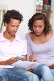 Couple calculating their budget stock images Couple calculating their budget stock images
