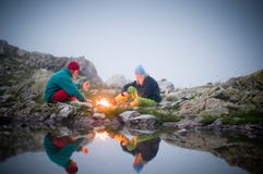 Couple camping at night