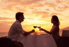 Couple Enjoying Romantic Sunnset Dinner Stock Image Couple Enjoying Romantic Sunnset Dinner Stock Image