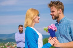 Couple with flowers bouquet romantic date. New love. Couple in love dating outdoor sunny day, sky background. Ex partner stock images Couple with flowers bouquet romantic date. New love. Couple in love dating outdoor sunny day, sky background. Ex partner stock images