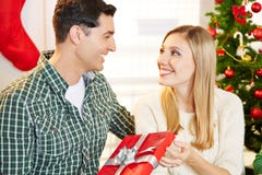 Couple with gift at christmas Royalty Free Stock Image Couple with gift at christmas Royalty Free Stock Image