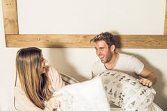 Couple of guy and girl in bed smiling and happy. Girl and guy couple showing affection in bed royalty free stock photos Couple of guy and girl in bed smiling and happy. Girl and guy couple showing affection in bed royalty free stock photos