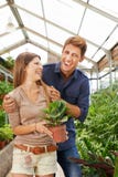 Couple has fun shopping in the garden center royalty free stock photography Couple has fun shopping in the garden center royalty free stock photography