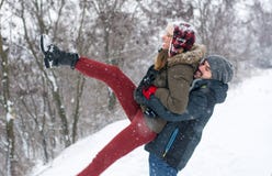 Couple having fun in snow covered park stock photo Couple having fun in snow covered park stock photo