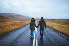 Couple Holding Hands On Road Royalty Free Stock Photography