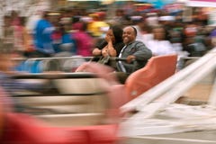 Couple Laughs Riding Scrambler Carnival Ride At Atlanta Fair stock photos Couple Laughs Riding Scrambler Carnival Ride At Atlanta Fair stock photos