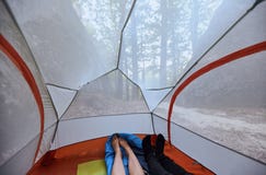 Couple in love lying in a tent with view on the mountains royalty free stock image Couple in love lying in a tent with view on the mountains royalty free stock image
