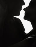 Couple in love silhouette looking white light royalty free stock photography Couple in love silhouette looking white light royalty free stock photography