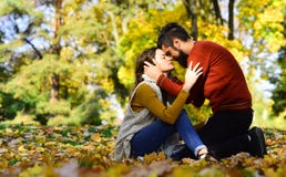 Couple in love sitting on autumn fallen leaves royalty free stock photo Couple in love sitting on autumn fallen leaves royalty free stock photo