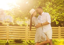 couple in love at sunset walking in the park happy, American dream. The concept of family values. royalty free stock photography couple in love at sunset walking in the park happy, American dream. The concept of family values. royalty free stock photography