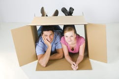 Couple lying in box