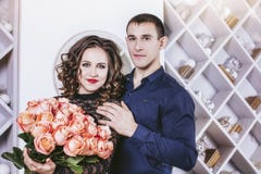 Couple man gives a woman a bouquet of flowers roses beautiful an stock images Couple man gives a woman a bouquet of flowers roses beautiful an stock images