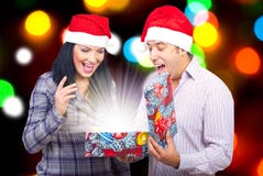Couple Open A Magic Christmas Gift Royalty Free Stock Photography
