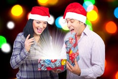 Couple open a magic Christmas gift