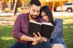 Couple Reading Outdoors Stock Photo Couple Reading Outdoors Stock Photo