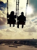 Couple on a seesaw. Inspiration, love and dreams Stock Image Couple on a seesaw. Inspiration, love and dreams Stock Image