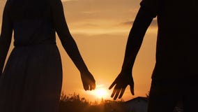 [Image: couple-separating-their-hands-sunset-lov...118417.jpg]