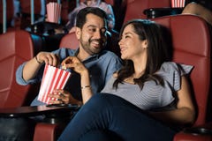 https://thumbs.dreamstime.com/t/couple-sharing-popcorn-movies-happy-hispanic-watching-movie-cinema-theater-some-96838209.jpg