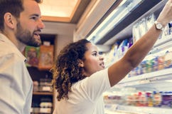 Couple shopping together at a supermarket royalty free stock photos Couple shopping together at a supermarket royalty free stock photos