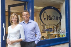 Couple standing at entrance of optometrists