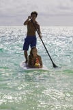 Couple on standup paddle board Royalty Free Stock Photos Couple on standup paddle board Royalty Free Stock Photos