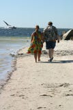 Couple Strolling On Beach Royalty Free Stock Images