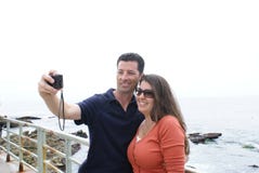 Couple Taking Photograph Of Themselves Royalty Free Stock Images