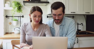 Couple talking using laptop discuss future online ecommerce purchase