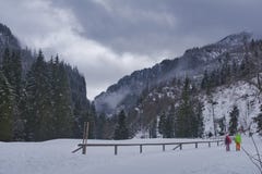 A couple of tourists on a winter trip in the mountains stock photos A couple of tourists on a winter trip in the mountains stock photos
