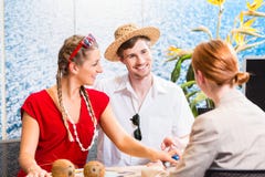 Couple in travel agency booking vacation trip Royalty Free Stock Photo Couple in travel agency booking vacation trip Royalty Free Stock Photo