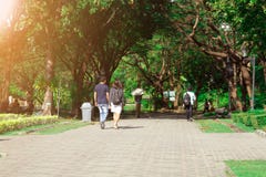 Couple walking at public park. Romantic mood concept. stock image Couple walking at public park. Romantic mood concept. stock image