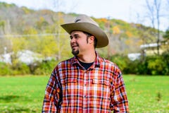 Cowboy Rancher Looking to side and smiling stock image Cowboy Rancher Looking to side and smiling stock image