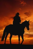 Cowboy silhouette in sunrise